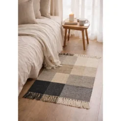 Rechthoekig katoenen tapijt met beige en zwarte motieven 90 x 60 cm