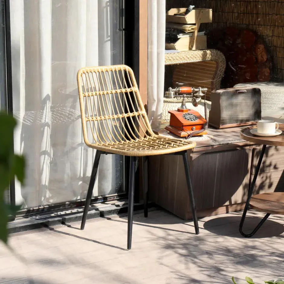 Set van 4 metalen en rotan tuinstoelen