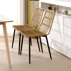 Set van 4 metalen en rotan tuinstoelen